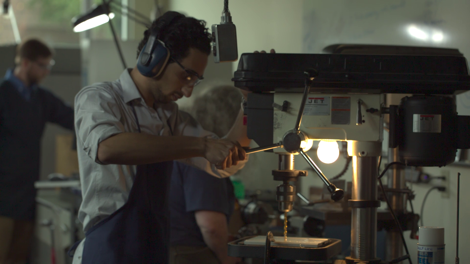 Student using drill press